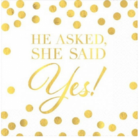 He Asked She Said Yes engagement beverage napkins, 2-ply, pack of 16, on a drinks table
