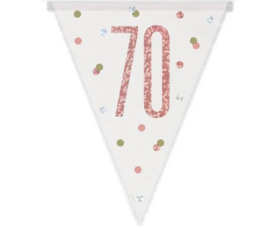 Rose gold and silver 70th birthday bunting strung above a milestone party table