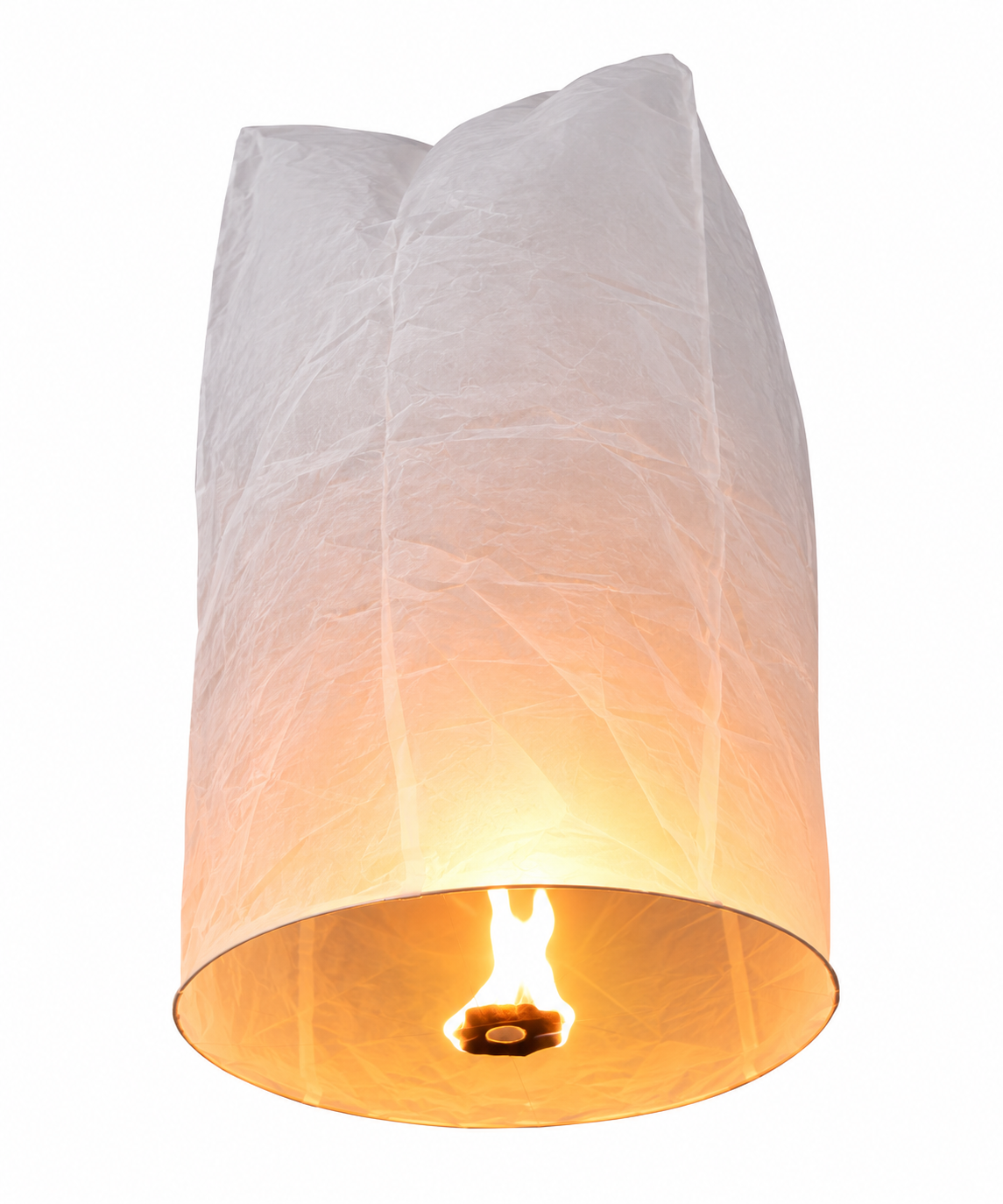 Flying sky lantern glowing as it rises into the night sky at a celebration