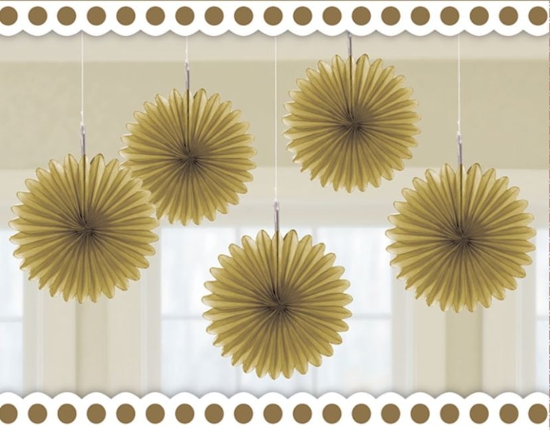Gold paper fan decorations hanging against a white background with decorative border.
