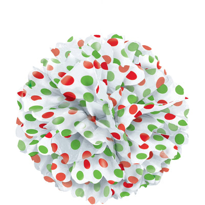 Red and green polka dot tissue puff ball hanging as a Christmas party decoration