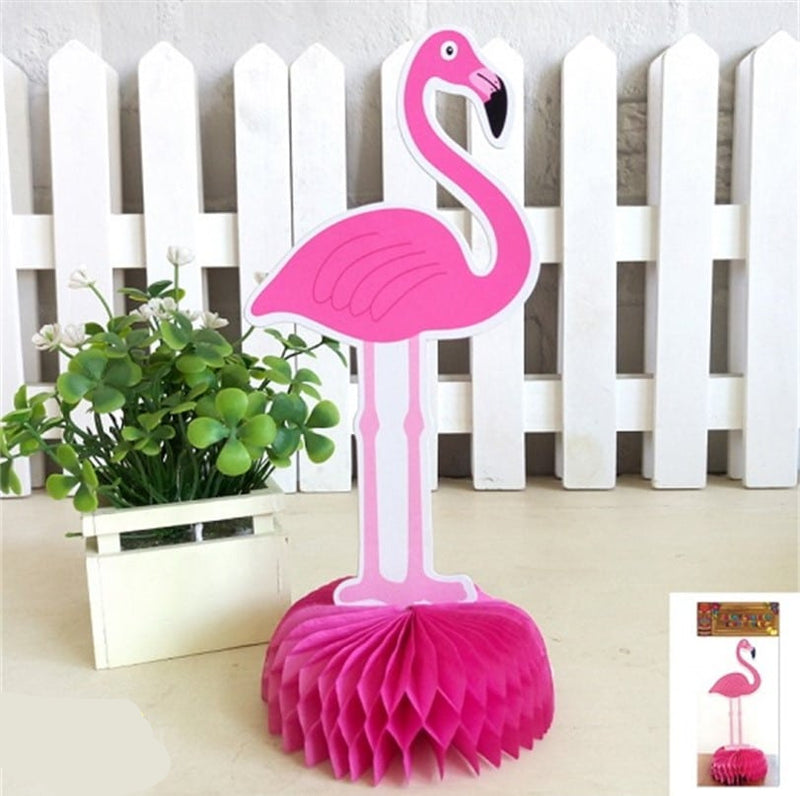 Pink flamingo decoration with a white picket fence and plant in the background, Party World branding visible.